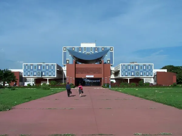 Modern university building at the end of a wide walkway