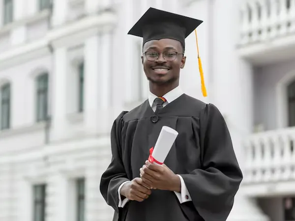 Young African man graduate holding his diploma